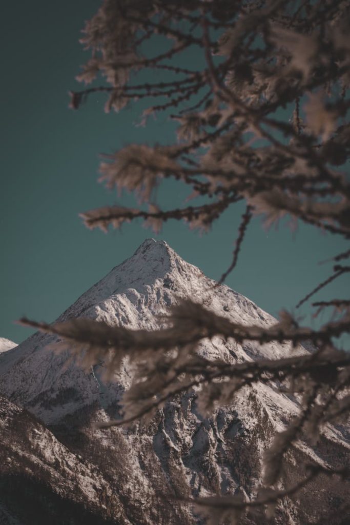 Breathtaking view of snow-capped mountain peaks in Saas-Fee, Switzerland during winter.